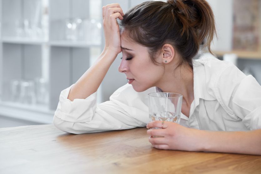Portrait of woman with headache